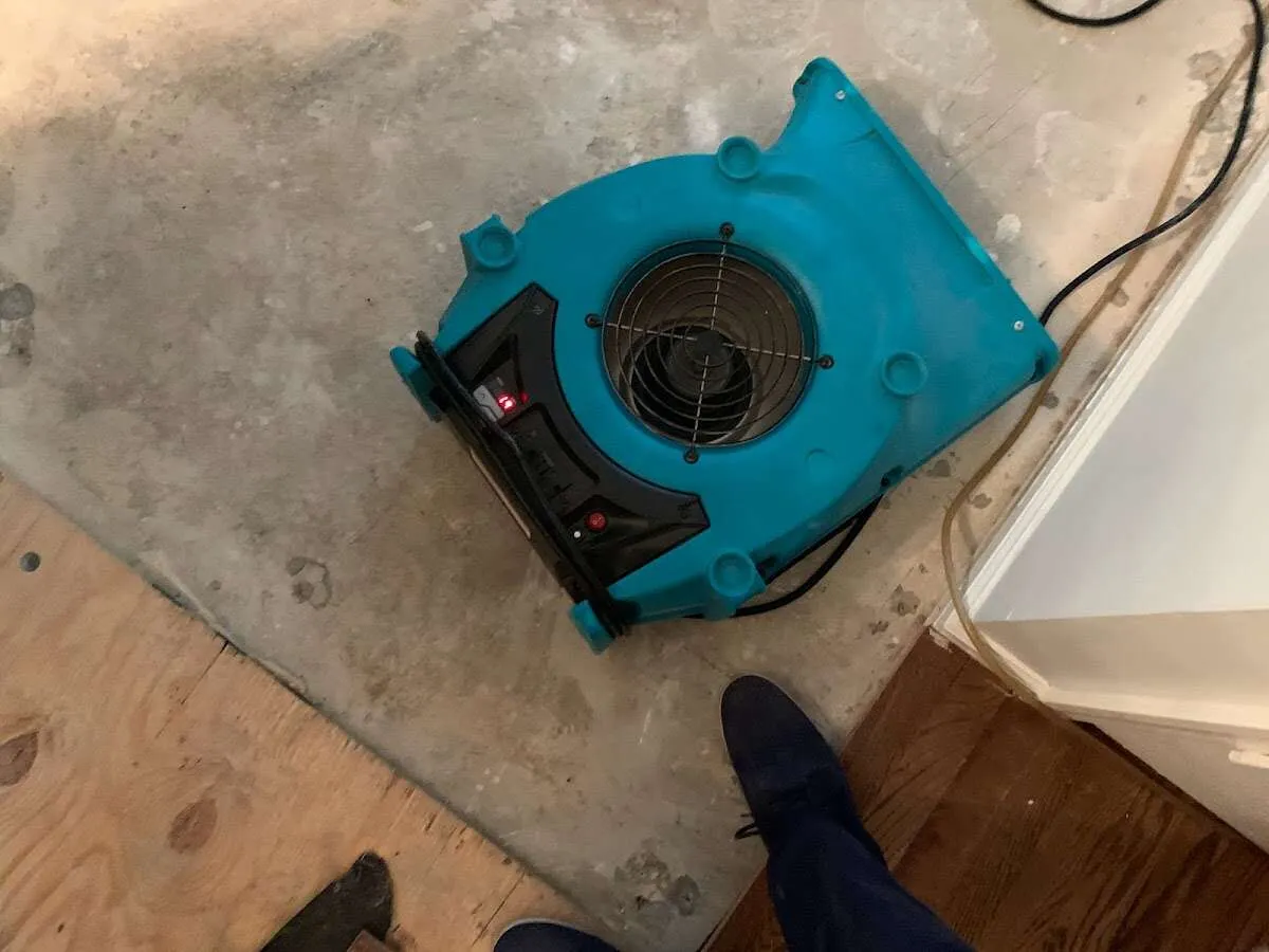 Air mover drying subfloor during Commercial Water Damage Restoration in North Codorus